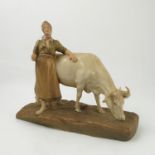 A Royal Dux figure, modelled as a milk maid and cow, model number 1546,