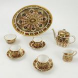 A Royal Crown Derby dolls cabaret set, comprising a tray, tea pot, milk jug and sugar bowl,