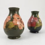 Two Moorcroft Pottery vases, of baluster form, decorated in the Hibiscus pattern,