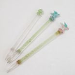 Three glass cocktail sticks, with coloured glass finials, two modelled with birds,