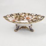 A Royal Crown Derby oval comport, decorated in a version of the Imari pattern, with shaped edge,