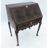 An 18th century oak bureau,