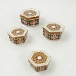 A graduated set of four Royal Crown Derby hexagonal boxes,
