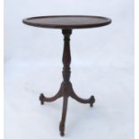 A circular oak occasional table,