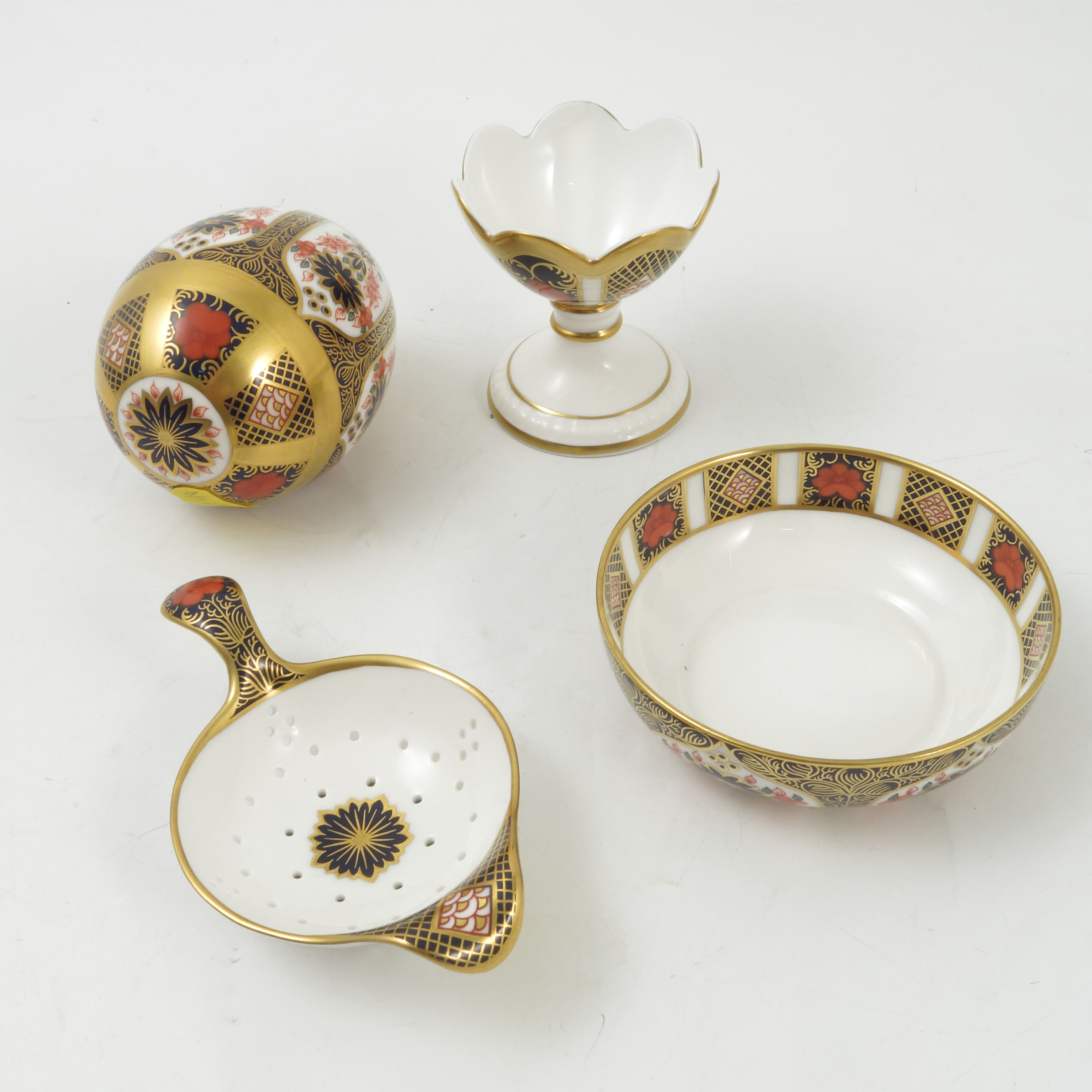 A Royal Crown Derby tea strainer and stand, together with an ornamental egg and cup, - Image 2 of 2