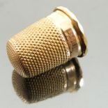 A 14 carat gold thimble, Birmingham 1938, of usual form, height 2.2cm, weight 6.