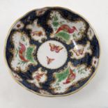 A Samson of Paris porcelain deep saucer, decorated with reserves of fabulous birds and insects,