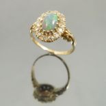 An opal and diamond cluster ring circa 1910,