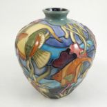 A Moorcroft Pottery vase, decorated in the Martinique pattern with fish, reeds and colour,