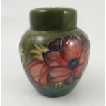 A Moorcroft ginger jar, the base inscribed WM, decorated with flowers to a green ground,