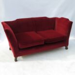 A 18th century style sofa of Knoll proportions, raised on short turned legs,