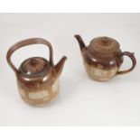 A Doulton Lambeth stoneware tea pot, with typical decoration,