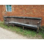 A section of 19th century corner club bench seating, with a tongue and groove back,