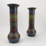 A pair of Dutch pottery vases, in the Gouda style, decorated with stylised leaves,