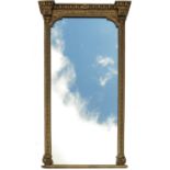 A large gilt frame over mantel mirror, decorated with harebells and stylised foliage,