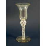 A 19th century drinking glass, with flared rim, the shaped stem with opaque twist, height 6.