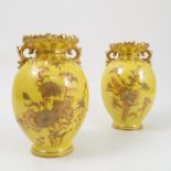 A pair of Royal Crown Derby vases, with shaped and embossed necks,