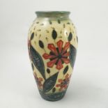 A modern Moorcroft Pottery vase, decorated with stylised flower heads and leaves,