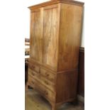 A 19th century mahogany linen press, having two panel doors opening to reveal an altered interior,