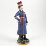 A Russian porcelain figure, possibly from the Gardner factory,