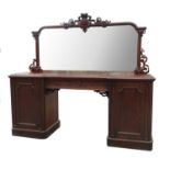 A 19th century mahogany mirror backed sideboard, having a large shaped mirror back,