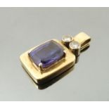 A Tanzanite and diamond pendant, the rectangular cut stone measuring approximately 9.5mm x 7.