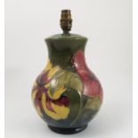 A Moorcroft pottery lamp base, decorated in the Hibiscus pattern,