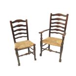 A set of eight (6 + 2) North Country style ladder back dining chairs, with rushed seats,