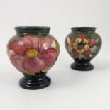 Two Moorcroft Pottery vases, the baluster bodies decorated in the Clematis and Columbine patterns,