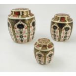 A graduated set of three Royal Crown Derby covered ginger jars, decorate din the 1128 Imari pattern,