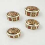 A set of four Royal Crown Derby graduated oval patch boxes, decorated in the 1128 Imari pattern,