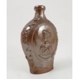 A 19th century stoneware flagon, embossed with portraits of Queen Victoria and Prince Albert,