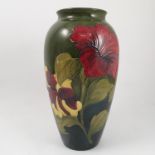 A Moorcroft pottery vase, decorated in the Hibiscus pattern,