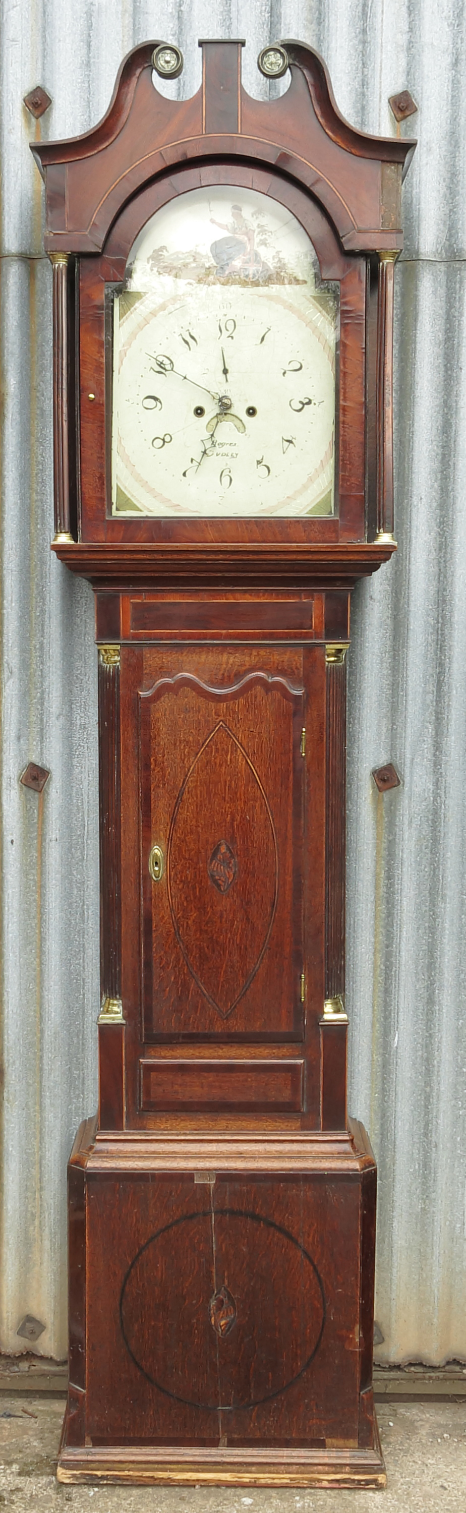 A late Georgian oak long case clock, with arched enamel dial by Rogers of Dudley,