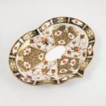 A Royal Crown Derby shaped dish, decorated in a version of the Imari pattern, restored, diameter 10.