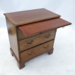 A late Georgian mahogany chest, with three graduated long drawers fitted below a brushing slide,