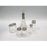 A Pair of Silver Topped Slice Cut Glass Dressing Table Bottles, two other, sugar shaker and