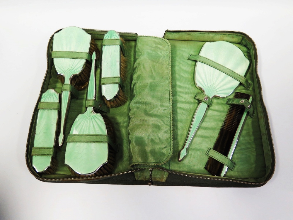 An Edward VIII Silver and Green Guilloché Enamel Backed Six Part Mirror & Brush Set in soft case,