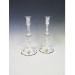 A Pair of Late Eighteenth Century Battersea Enamel Candlesticks decorated with floral sprays,