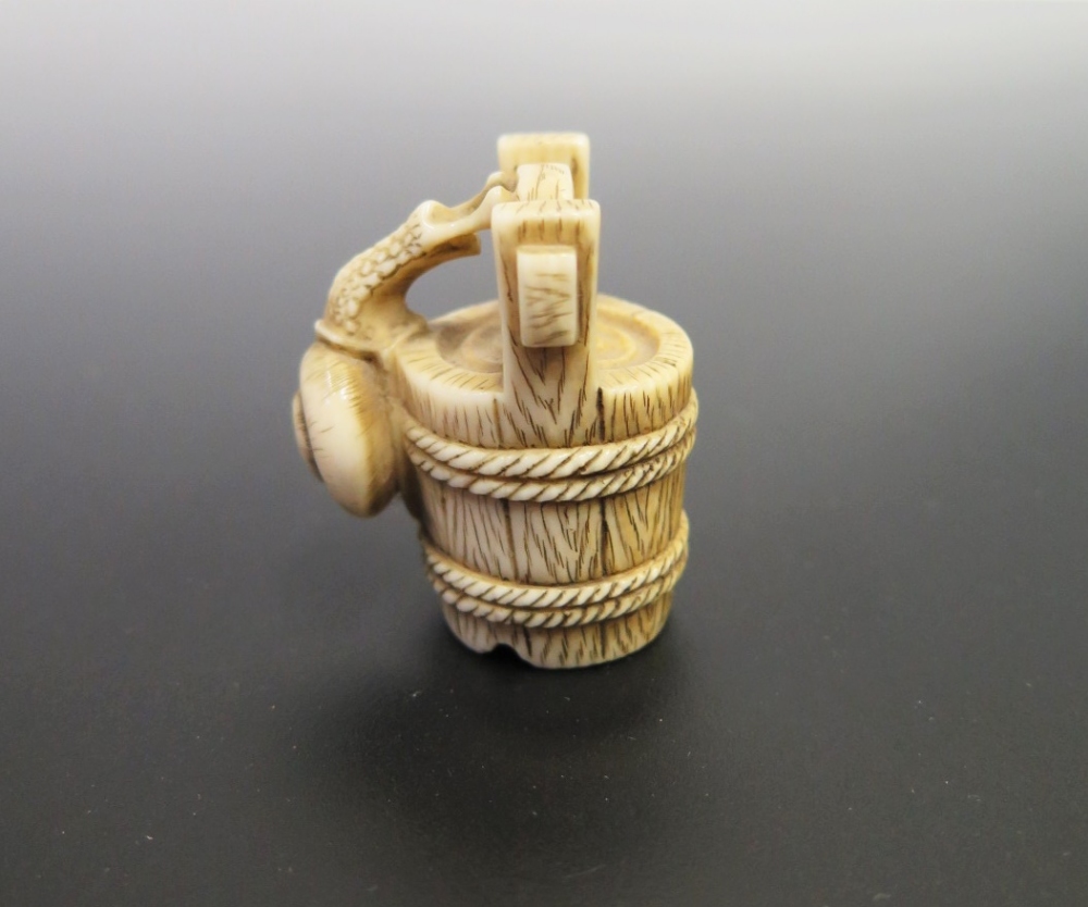 A Japanese Ivory Netsuke carved in the form of a snail climbing a bucket, signed to the base, c. - Image 3 of 4