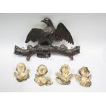 A Black Forest Carved Coat Rack decorated with an eagle, 40cm wide, tip of wing missing and four