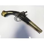 An 18th Century Spanish Miquelet Flintlock Pistol with silver wire inlay and brass sheathed