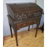 An Eighteenth Century Oak Bureau on stand with single frieze drawer, the interior fitted with