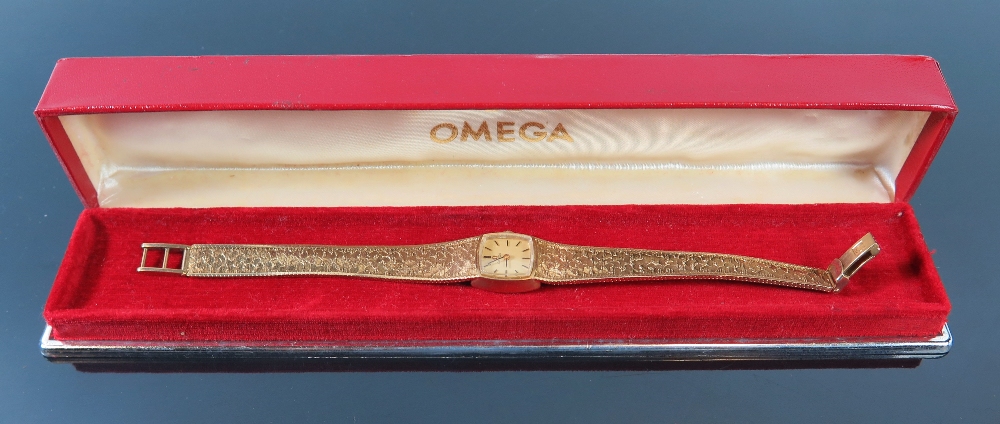 An Omega 9ct Gold Lady's wristwatch with integral bracelet 21.4g inc