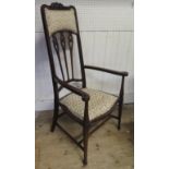 An Edwardian Carved Mahogany High Back Open Arm Chair