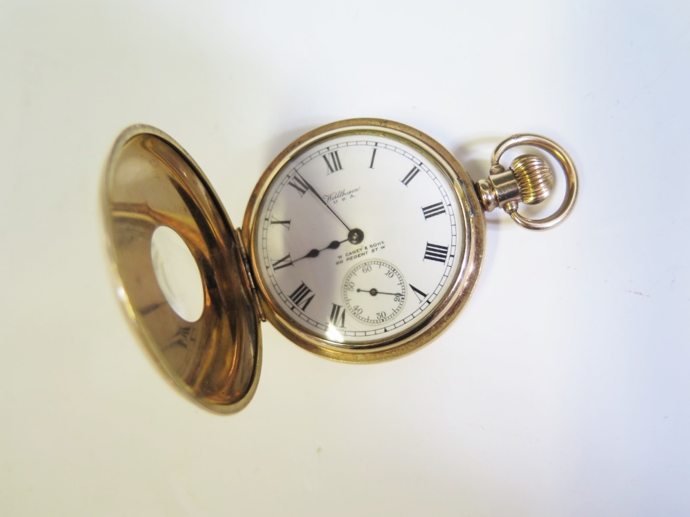 A Waltham Dennison Gold Plated Cased Half Hunter Pocket Watch with enamelled dial, running