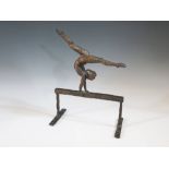 A Kenneth Carter bronze sculpture of Olga Korbut, 29.5 cm high and with photographs