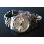 A Vintage Rolex Oyster Datejust in gold and steel case, serial number 702546, with receipt for