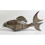 A Continental Silver Articulated Fish with hinged head and amethyst coloured inset eyes, 18cm, 95g