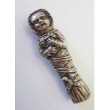 A Victorian Cast Silver Needle Case in the form of a figure wrapped in ribbons, London 1899, 62mm